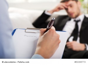 psychiatrist examining a male patient